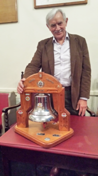 Ex-firefighter W.Bro. Bob Greenwell PrGSwdB with the bell